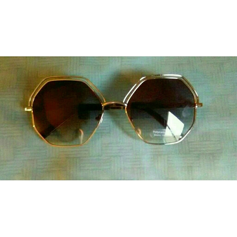 Octagon shaped purple lens sunglasses.